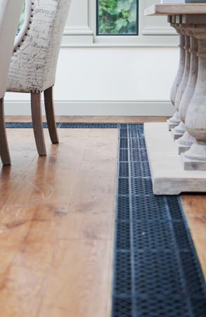 Close Up Of Floor Grilles Inset In A Wooden Floor